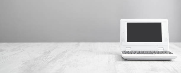 istock White laptop on the office desk. Technology concept 1292376724