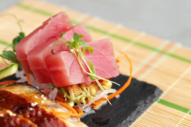 istock Sashimi sushi served on stone plate close up 1292376904