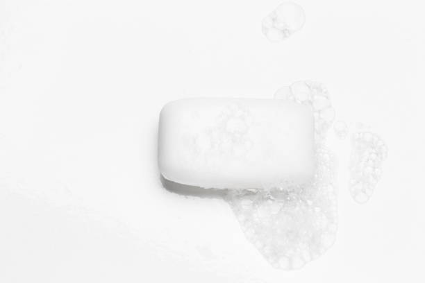 istock Soap bar and foam on white background, top view. Mockup for design 1292377642