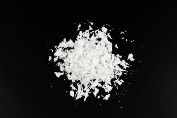 istock white artificial synthetic snow on black background 1292377807
