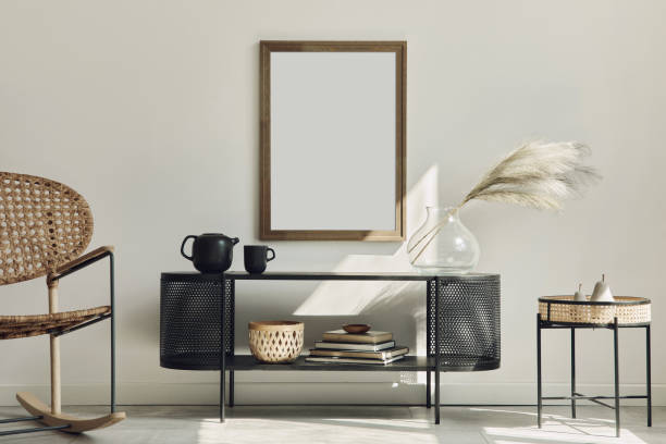 istock Modern scandinavian home interior with design wooden commode, mock up poster frame, decoration and personal accessories in stylish home decor. Template. 1292379205