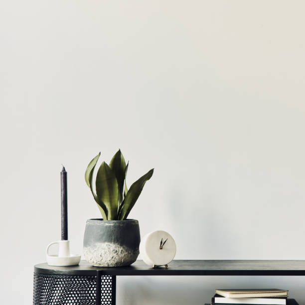 istock Modern scandinavian home interior with design wooden commode, mock up poster frame, decoration and personal accessories in stylish home decor. Template. 1292379217