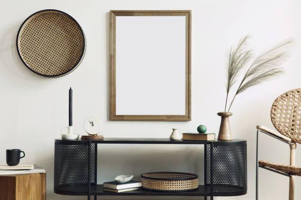 istock Modern scandinavian home interior with design wooden commode, mock up poster frame, decoration and personal accessories in stylish home decor. Template. 1292379262