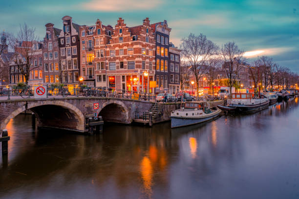 istock Amsterdam Netherlands, canals with lights during evening in December during wintertime in the Netherlands Amsterdam city 1292380283
