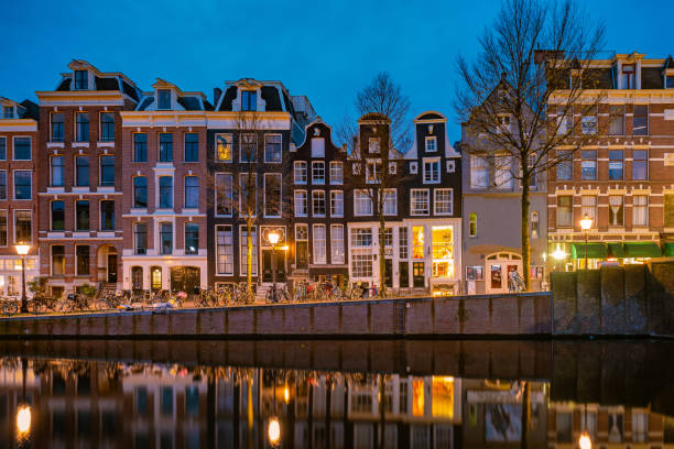 istock Amsterdam Netherlands, canals with lights during evening in December during wintertime in the Netherlands Amsterdam city 1292382847