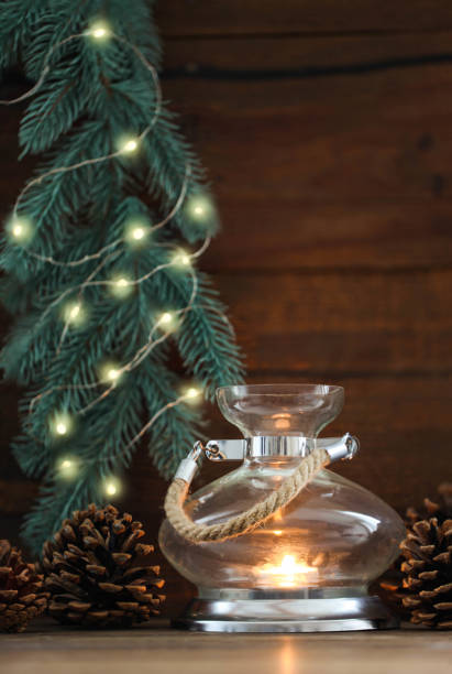istock Candlestick lamp and fir branches 1292383625
