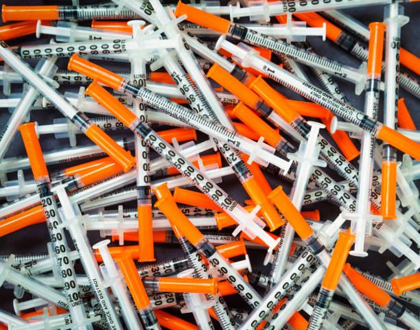 istock Orange Insulin Syringes for diabetic control 1292383680