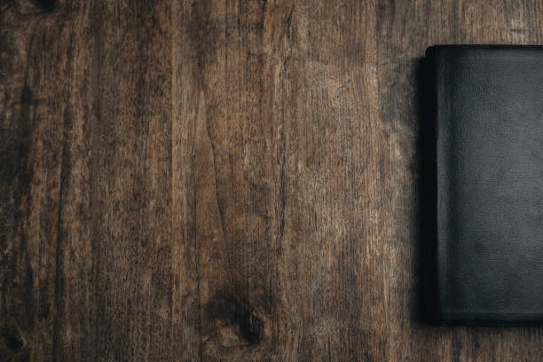 istock a closed bible on a wooden texture 1292384008