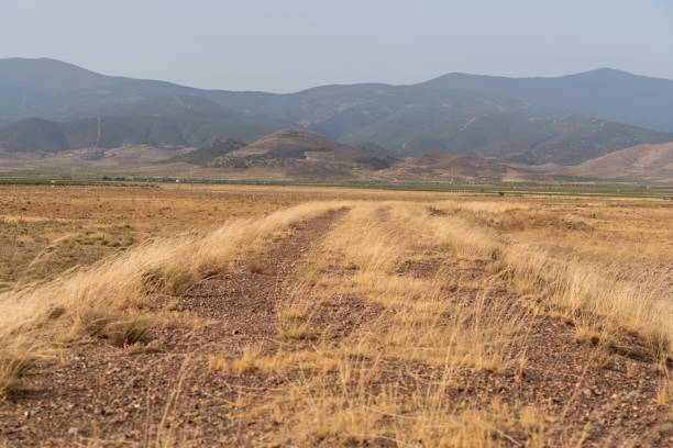 istock old dirt road to the mountain 1292384756
