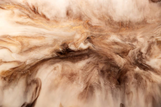 Abstract stains in browns, golds and whites. Background
