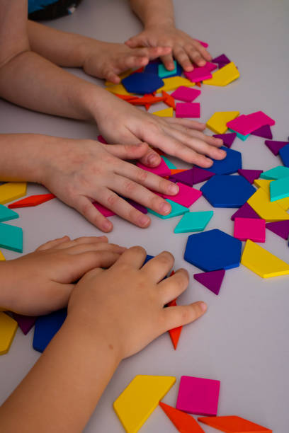 istock toddlers playing creative toy blocks, vertical photo 1292386418