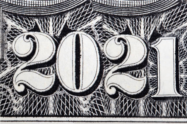 istock 2021 year - inscription arranged from banknotes 1292387342
