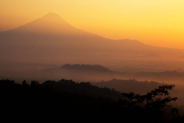 istock Sunrise view on the mountains and hills around Borobudur 1292387716