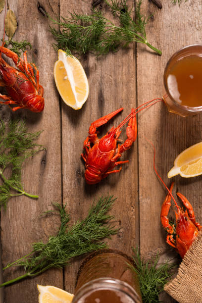 istock Crayfish boiled on a dish with dill spices and lemon. 1292388672