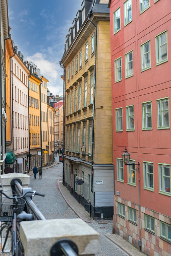 Sweden, vintage building at Stockholm, holiday at Gamla Stan. Upper part of rental apartment at Old Town, cloudy sky background, travel destination.