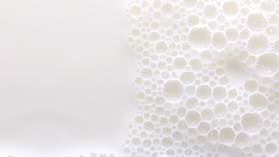 Bubbles on milk surface.