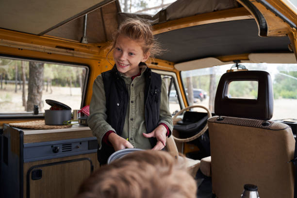istock Child helps her parents prepare for a picnic 1292394413