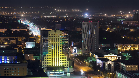 Illuminated builrings and traffic on the roads timelapse from rooftop at night in Astana. Kazakhstan capital 4K