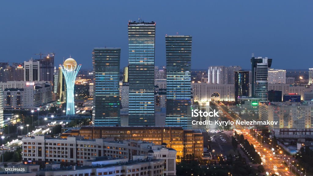 Elevated view over the city center and central business district day to night Timelapse, Central Asia, Kazakhstan, Astana Elevated aerial view over the city center and central business district from day to night transition Timelapse from rooftop, Central Asia, Kazakhstan, Astana. Traffic on the road Kazakhstan Stock Photo