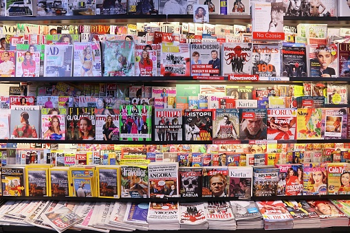 Press selection at a newsagents store at Krakow Airport in Poland. It is the second busiest airport in Poland with 5.8 million passengers (2017).