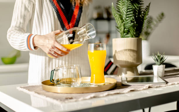 istock Drinking juice in the kitchen close up 1292399645