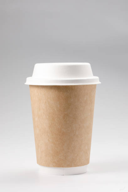 istock Takeaway coffee cup with lid. Isolated on a white background. Close-up. 1292399764