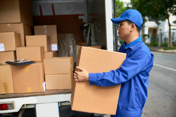 Delivery man loading truck stock photo