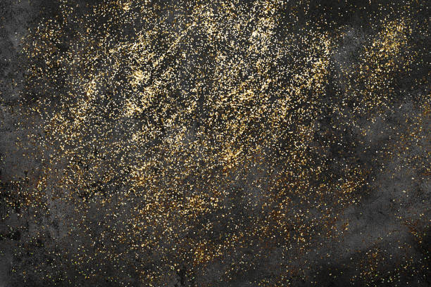 istock Dark Holiday Abstract Background With gold confetti. Sparkling texture. Festive backdrop for your projects 1292403032