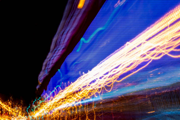 Big Data Coming Towards You A wall of blue light trails representing big data is veering off to the right and converging on the left-hand side of the image.  Abstract concept. quantum photos stock pictures, royalty-free photos & images