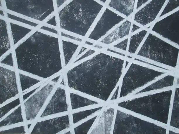 Random crisscross white thick parallel white lines on black and grey background. Hand drawn abstract background pattern and texture. Made by me (Laurence Berger) September 2018, Essex, United Kingdom. White soft pastel on black printing ink, on paper. Metaphor for networking and connections