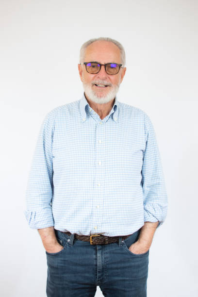 istock casual senior man posing with his hands in his pockets while smiling for the camera . isolated on white background 1292405972