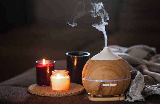 modern oil aroma diffuser wiht decor details copy space. - aromatic oil burner imagens e fotografias de stock