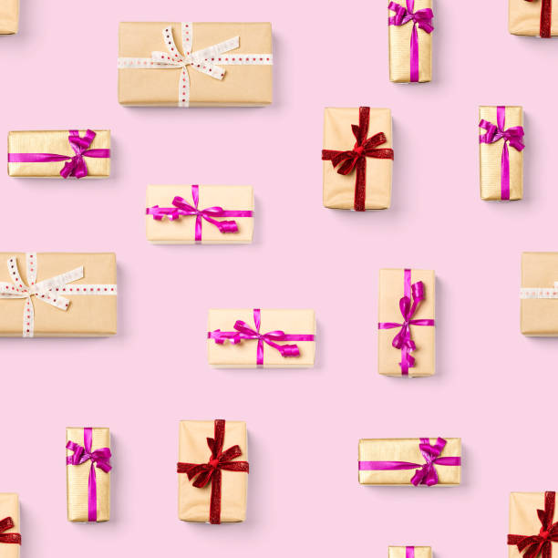 istock Seamless pattern made from gift boxes on pink background presents, gifts minimal concept seamless pattern. Abstract pattern for christmas birthday wedding 1292410428