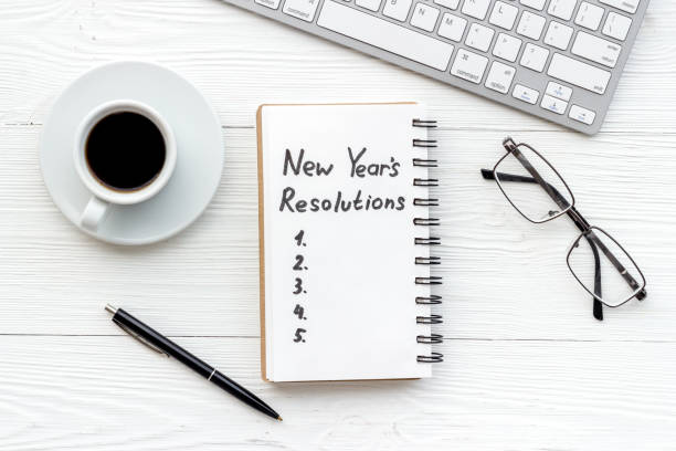 istock New Year Resolutions. Flat lay with Christmas decorations. Overhead view 1292410565