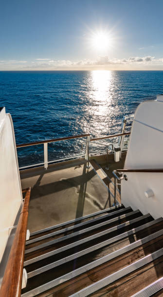 istock Sunset view from the stairs outside on a sailing cruise ship. 1292412827