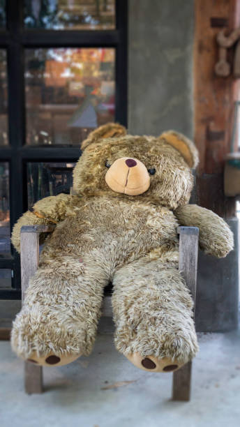 istock Cute teddy bear on the chair 1292413014