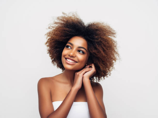 istock Beautiful smiling girl with curly hairstyle 1292413270