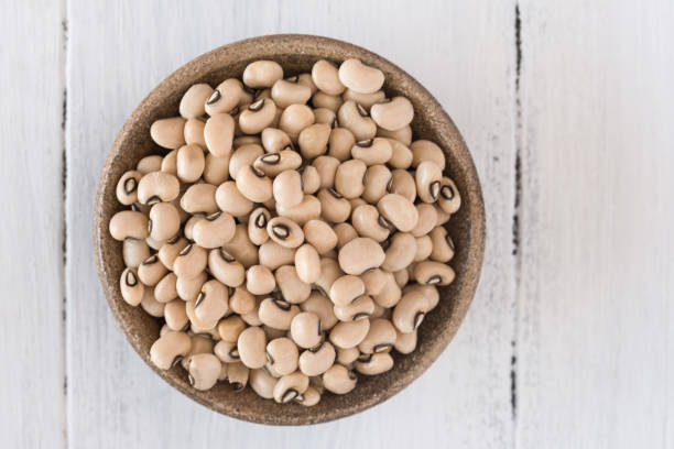Uncooked Black Eyed Peas in a Bowl stock photo