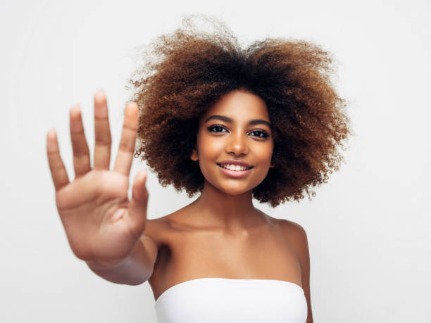 istock Beautiful young girl saying to stop 1292414068