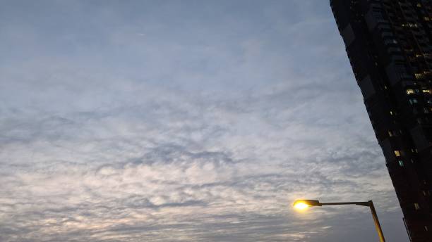 istock Street lamp and cloud at sunset 1292414381