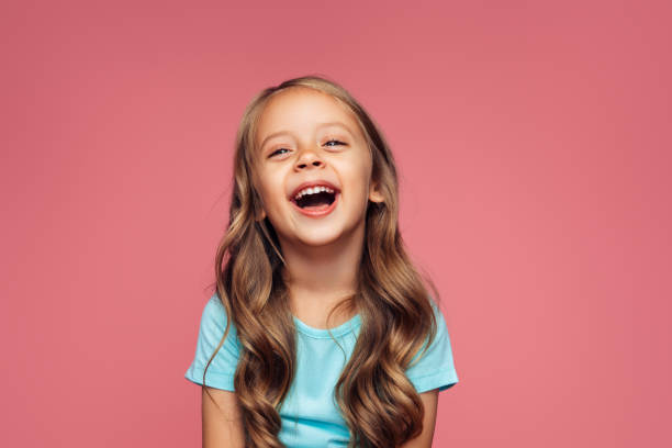 Funny girl on pink background Funny girl on pink background cheerful children stock pictures, royalty-free photos & images