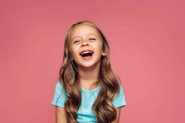 Photo of Funny girl on pink background