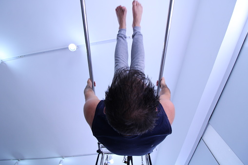 man doing pilates physical exercise