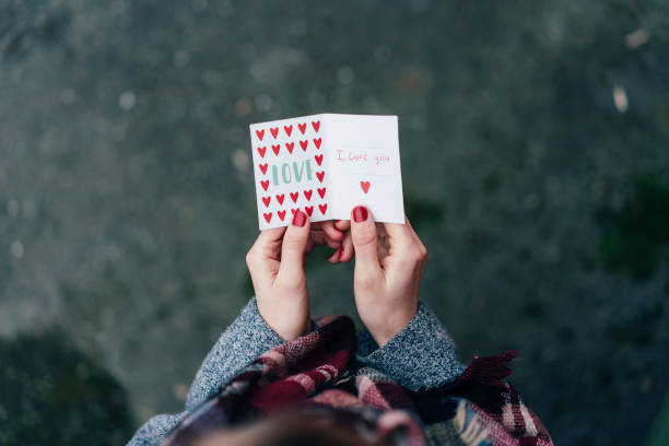istock Valentine postcard in female hands. 1292416698