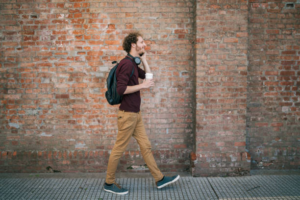 istock Young man talking on the phone outdoors. 1292418073