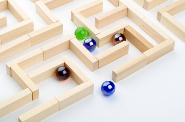 istock Concept - balls in a maze 1292418504