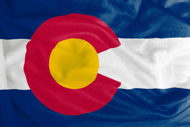 istock Colorado flag waving from textured fabric 1292420955