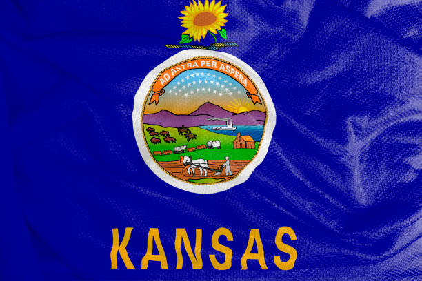 istock Kansas flag waving from textured fabric 1292421011