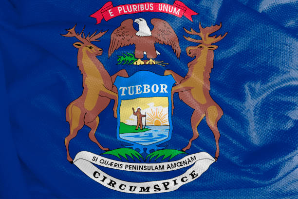 istock Michigan flag waving from textured fabric 1292421028