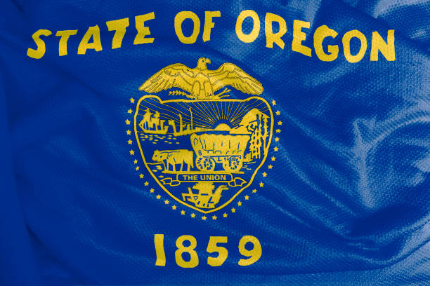 istock Oregon flag waving from textured fabric 1292421085